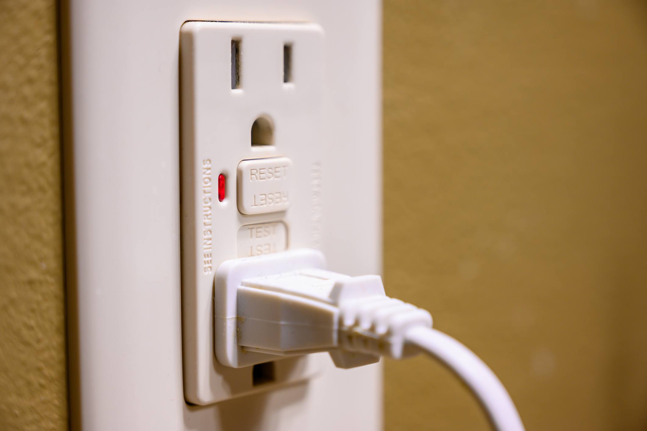 GFCI outlet with a cord plugged in